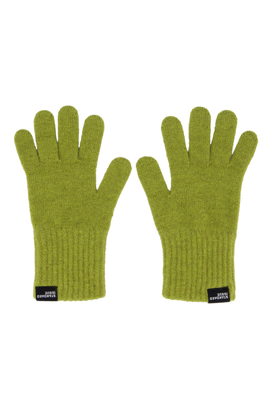 Pair of green gloves with brand labels on a white background